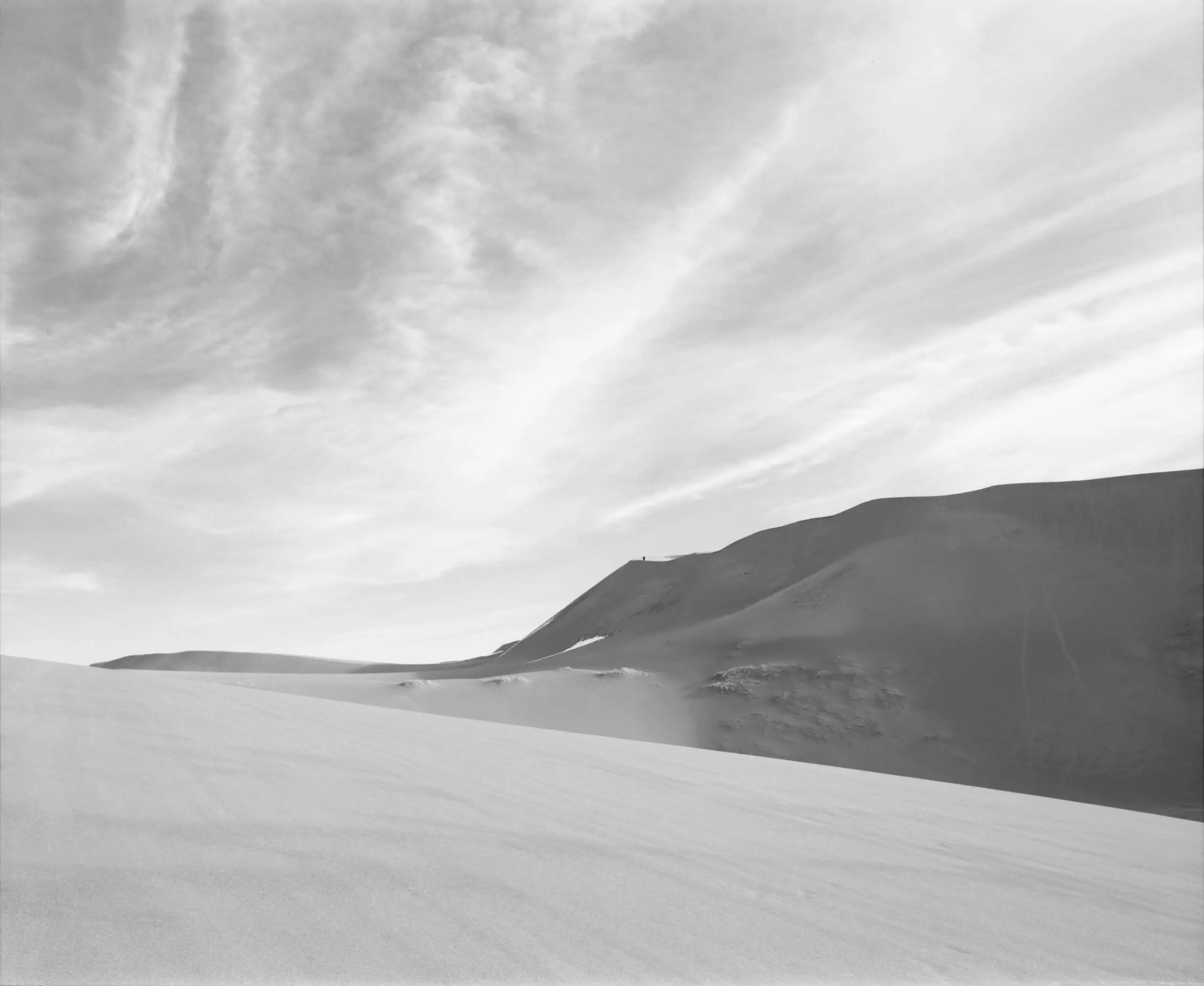 Minimalist black and white film study of dunes