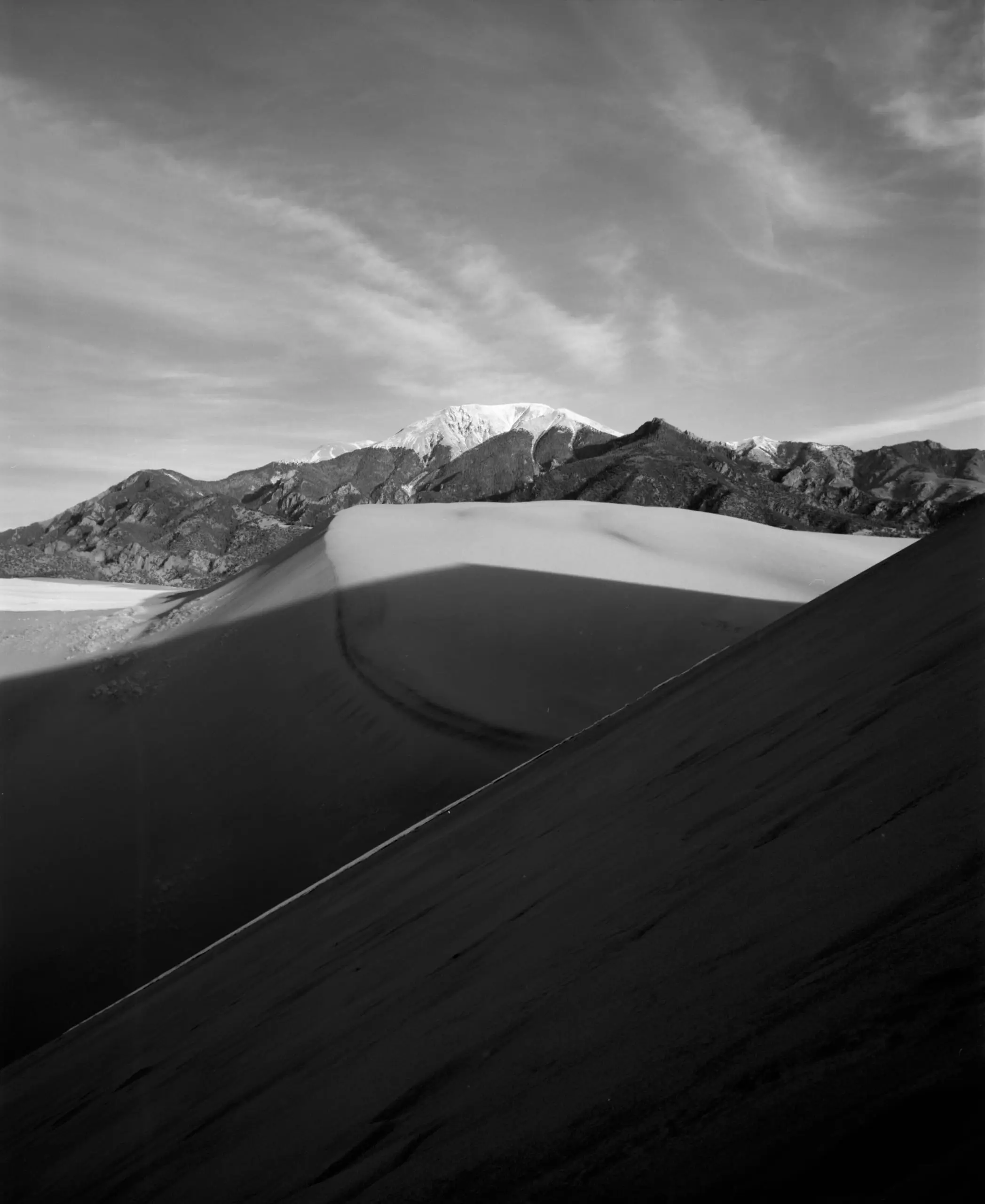Sand dunes and shadow on black and white film